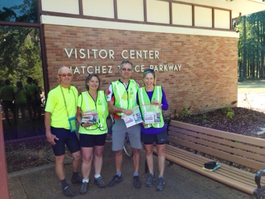 Bicyclists receive safety vests and lights at the Headquarters Visitor Center in Tupelo, Mississippi.