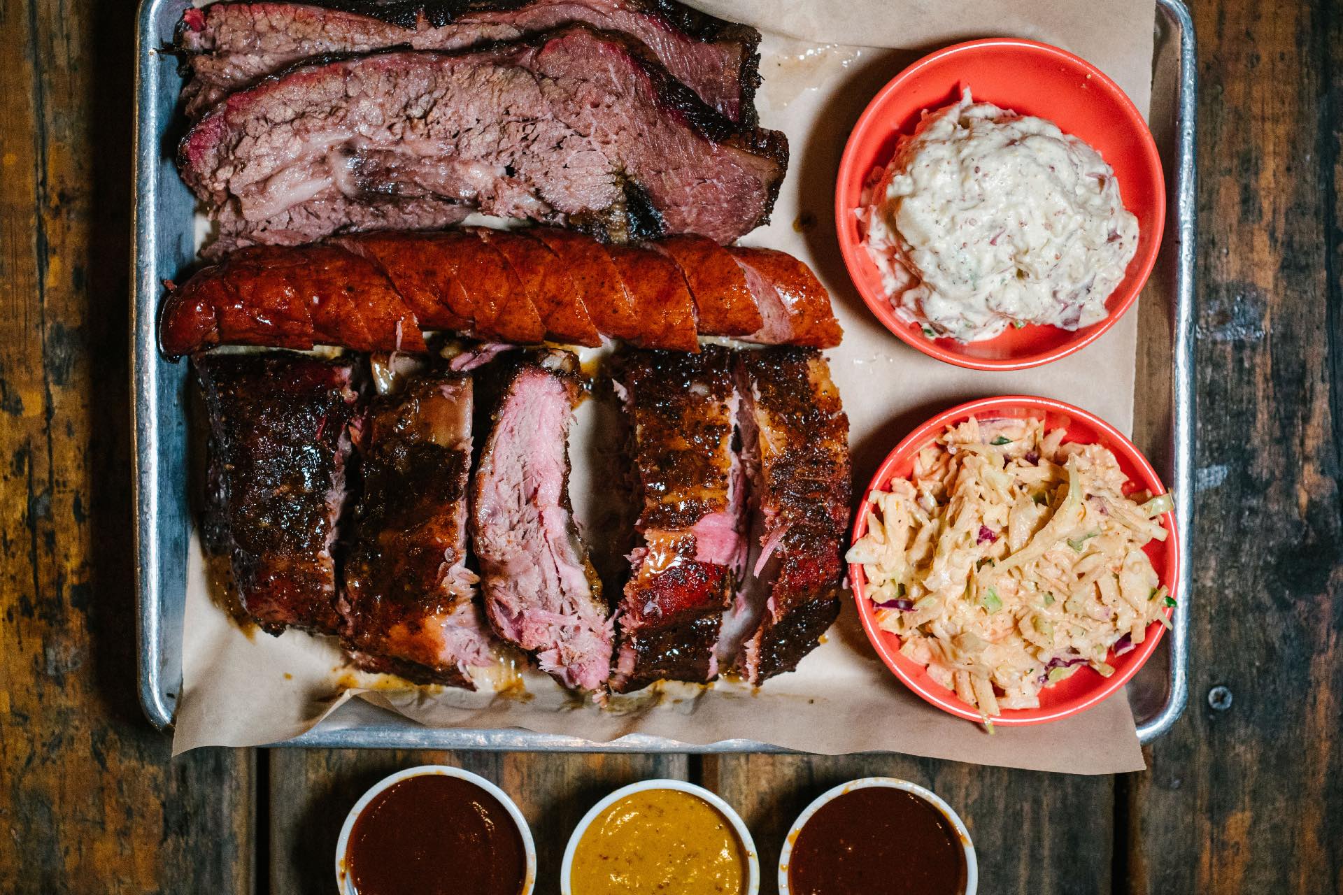 a platter of barbecue and sides