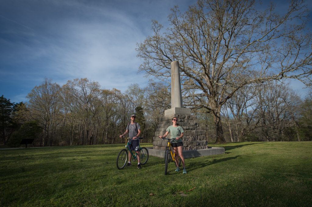 Bicyclists near monument